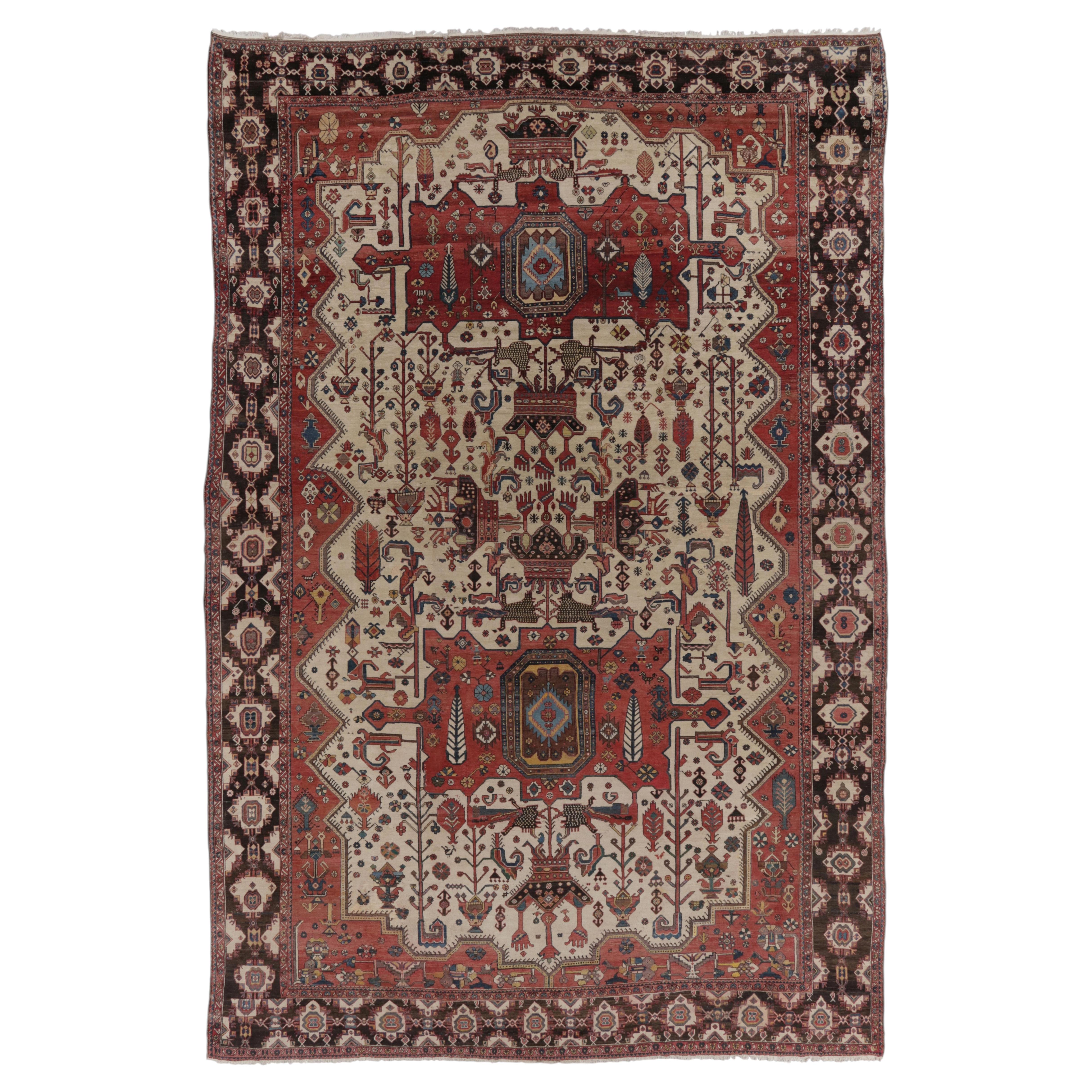 Tapis Bakhtiari ancien surdimensionné en rouge avec motifs géométriques - Rug & Kilim