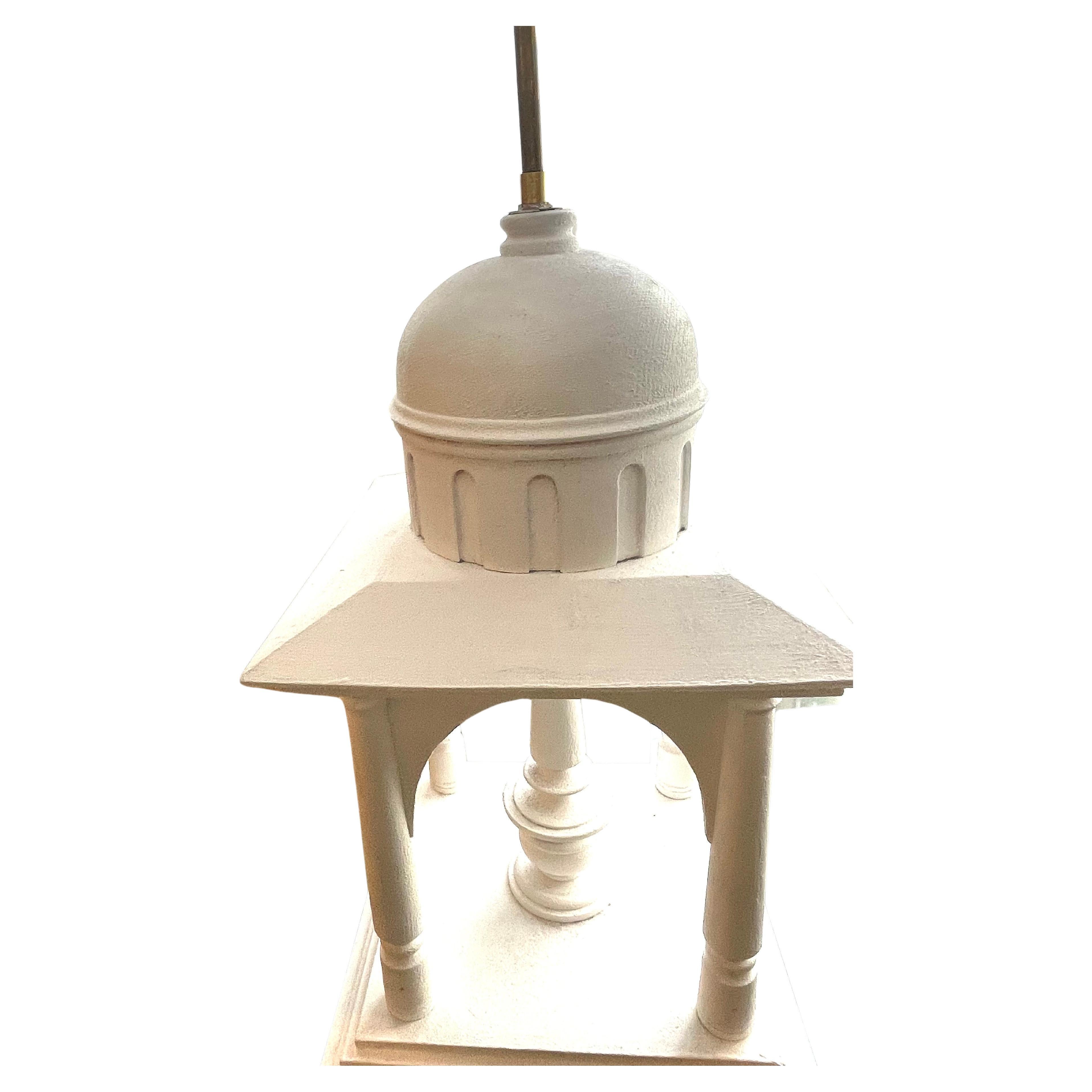 Lovely pair of white painted architectectural table lamps probably from India.
One light.
New creamy white lampshades.The square bases without the shades are:25cm on 25cm
Circa 1980.
