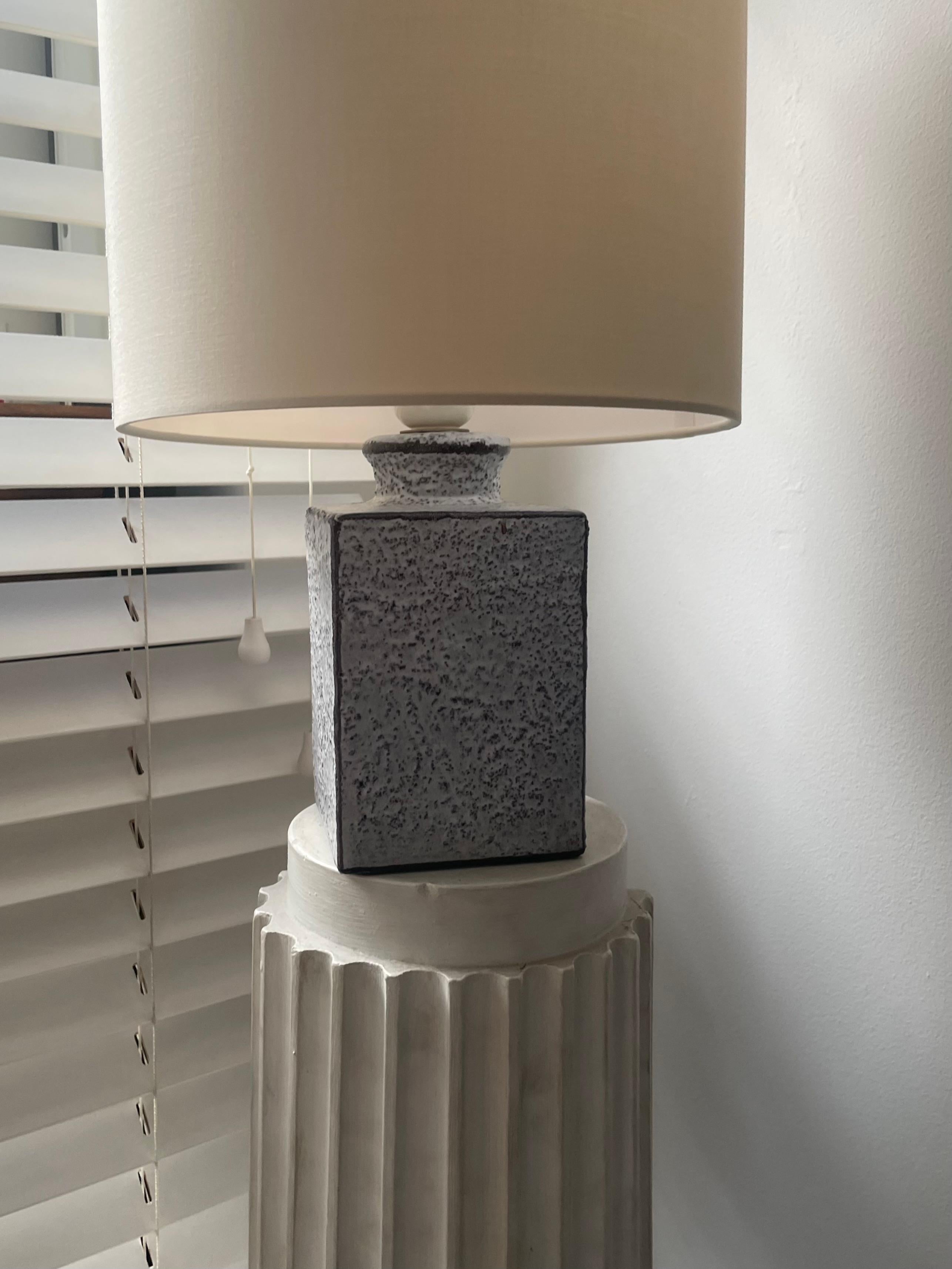 Square base ceramic lamp attributed to Bruno Gambone.
Paper label under the base 