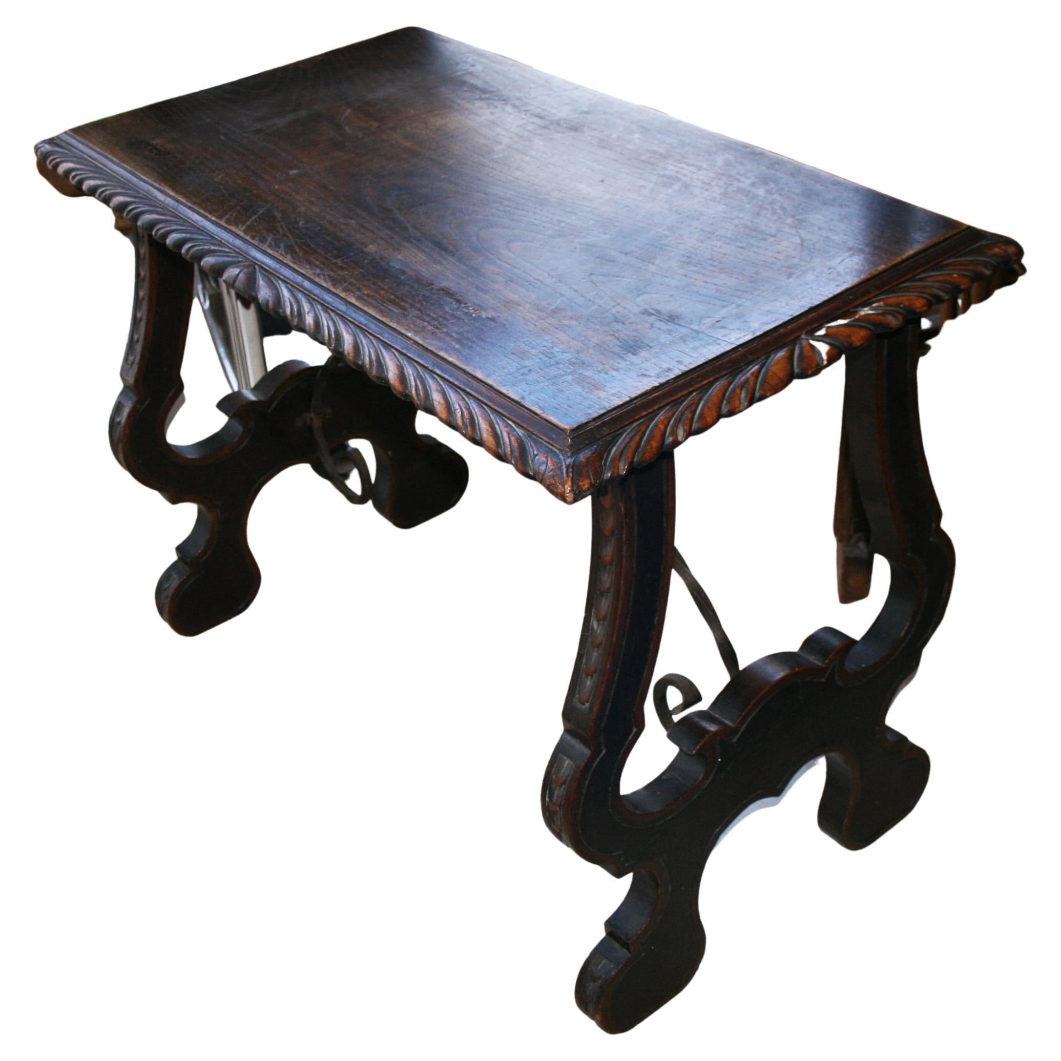 Museum quality

Console or side table of chestnut with carved lyre base and forged iron Stretcher, Spanish 18th century.

It is a beautiful jewel, worthy of any museum

Top of the table is one piece of chestnut wood carved around.

Legs in the shape