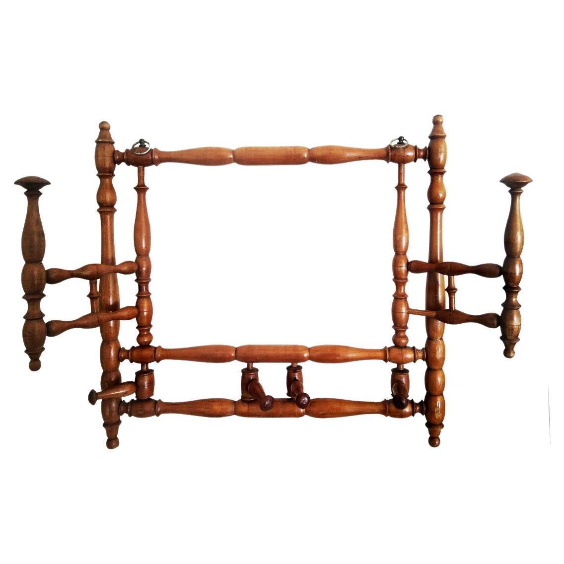 Perfect folding wall coat rack ideal for places of transit or small spaces since it can be folded if it is not being used
19th Century foldable wood wall coat rack,. 

Foldable with 6 hangers Unusual and original wall coat rack 
Maintains a