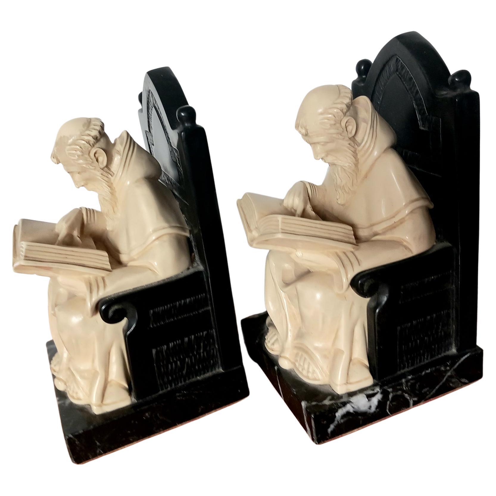 Alabaster and marble bookends in the shape of monks sitting on a throne reading a book. Figure of a monk is made of Bakelite or similar that rests on the albaster bench in Italian marble.
(a couple carved entirely in marble or alabaster is available