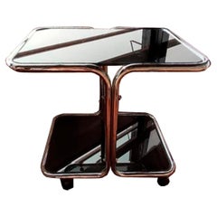  Coffee table steel tube and smoked glass with wheels Italy 70s