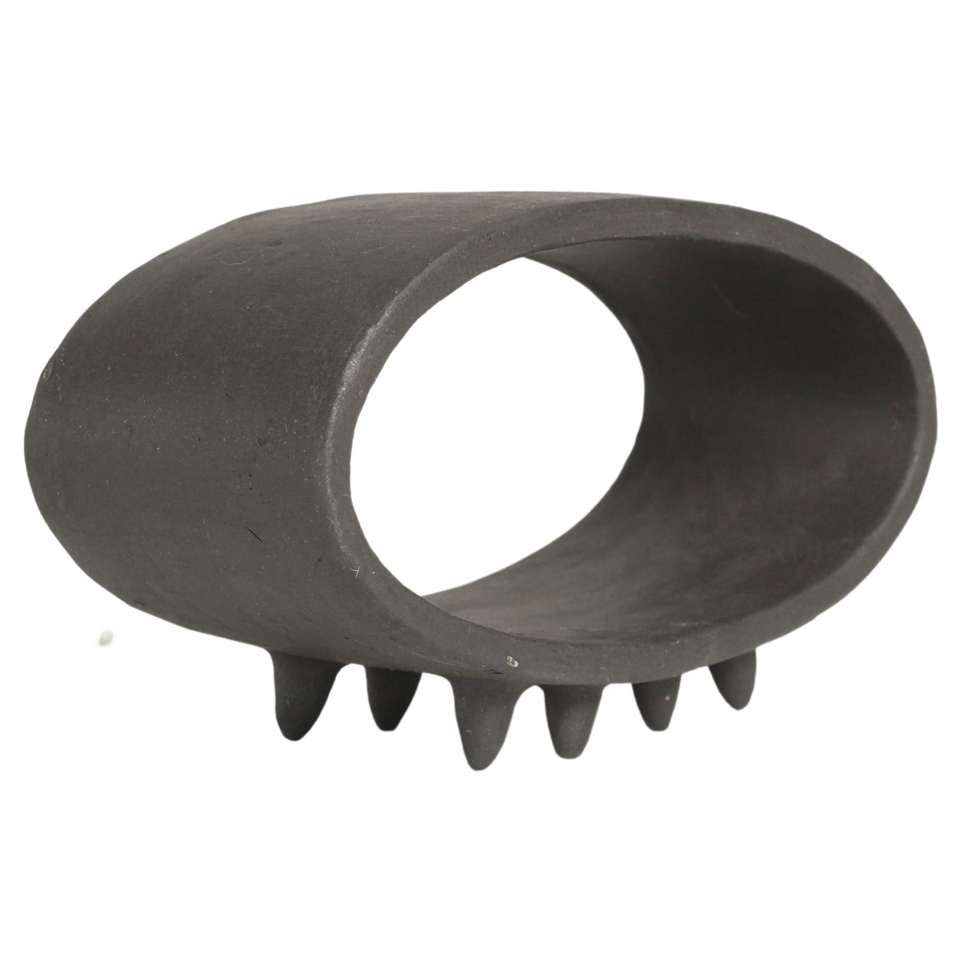 Black Oval Ceramic Sculpture with 2 Rows of Small Pointed Feet For Sale
