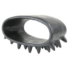Black Oval Ceramic Sculpture With Many Small Spike Feet