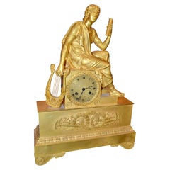 French Empire Figurative Gilt Bronze Clock of a Roman Youth Holding a Scroll