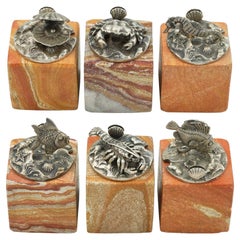 6 Ocean-themed card holders in sterling silver hardstone bases by Buccellati
