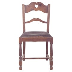 20th Century Rustic Chair with a Heart on the Back.