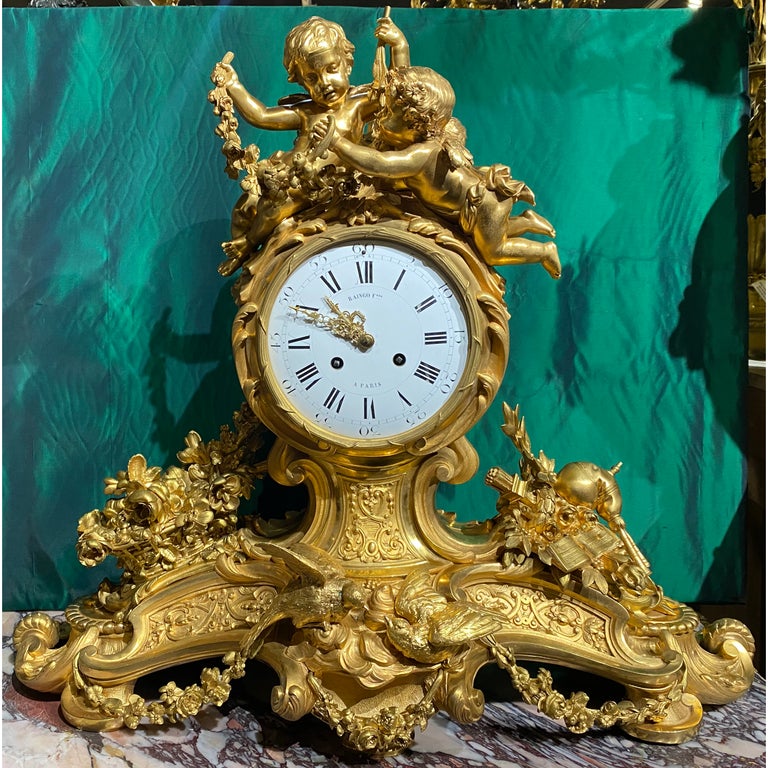 Louis XV style gilt bronze figural mantel clock
Mid/late 19th century
The 8-day time and strike movement with silk thread suspension, dial signed 