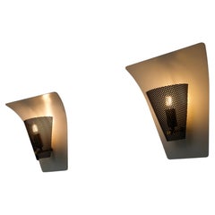 Par de apliques de metal perforado de Jacques Biny, Francia, década de 1960