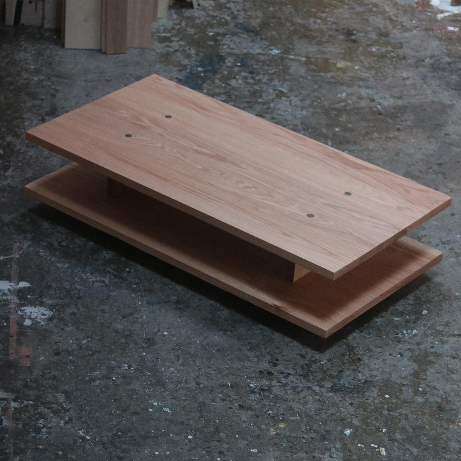 The Burke Coffee Table is constructed of solid red oak with walnut joinery and leg details.  The wood is all sourced from local suppliers in Canada and assembled in our Toronto studio.  The profile of the table is clean, linear, and architectural. 