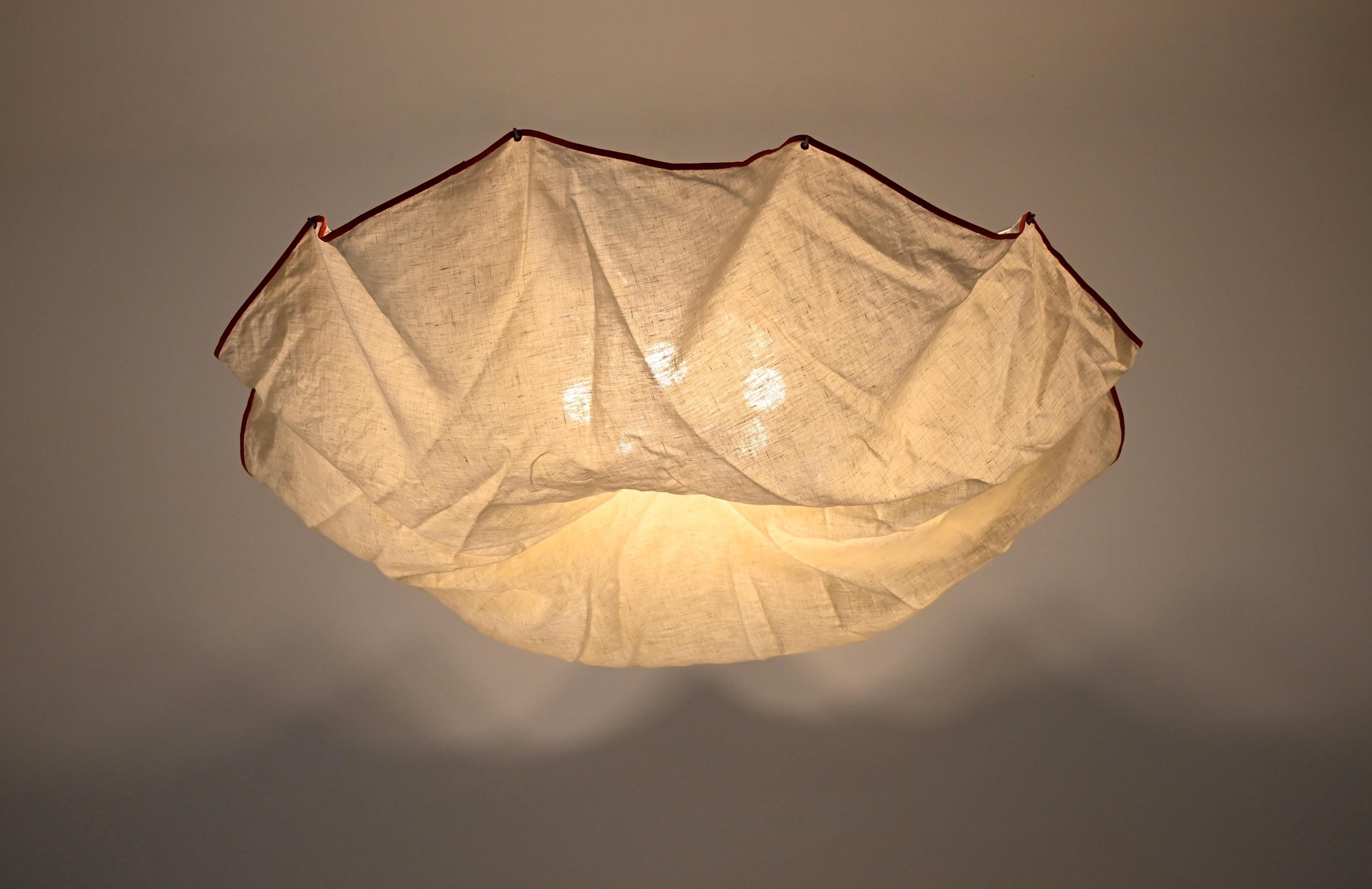 Ceiling light in white linen fabric and aluminum.  Model Celestia. Stamped Flos. Wear due to time and age. 
FOR SHIPPING, REQUEST US FOR RECEIVE THE BEST PRICE
