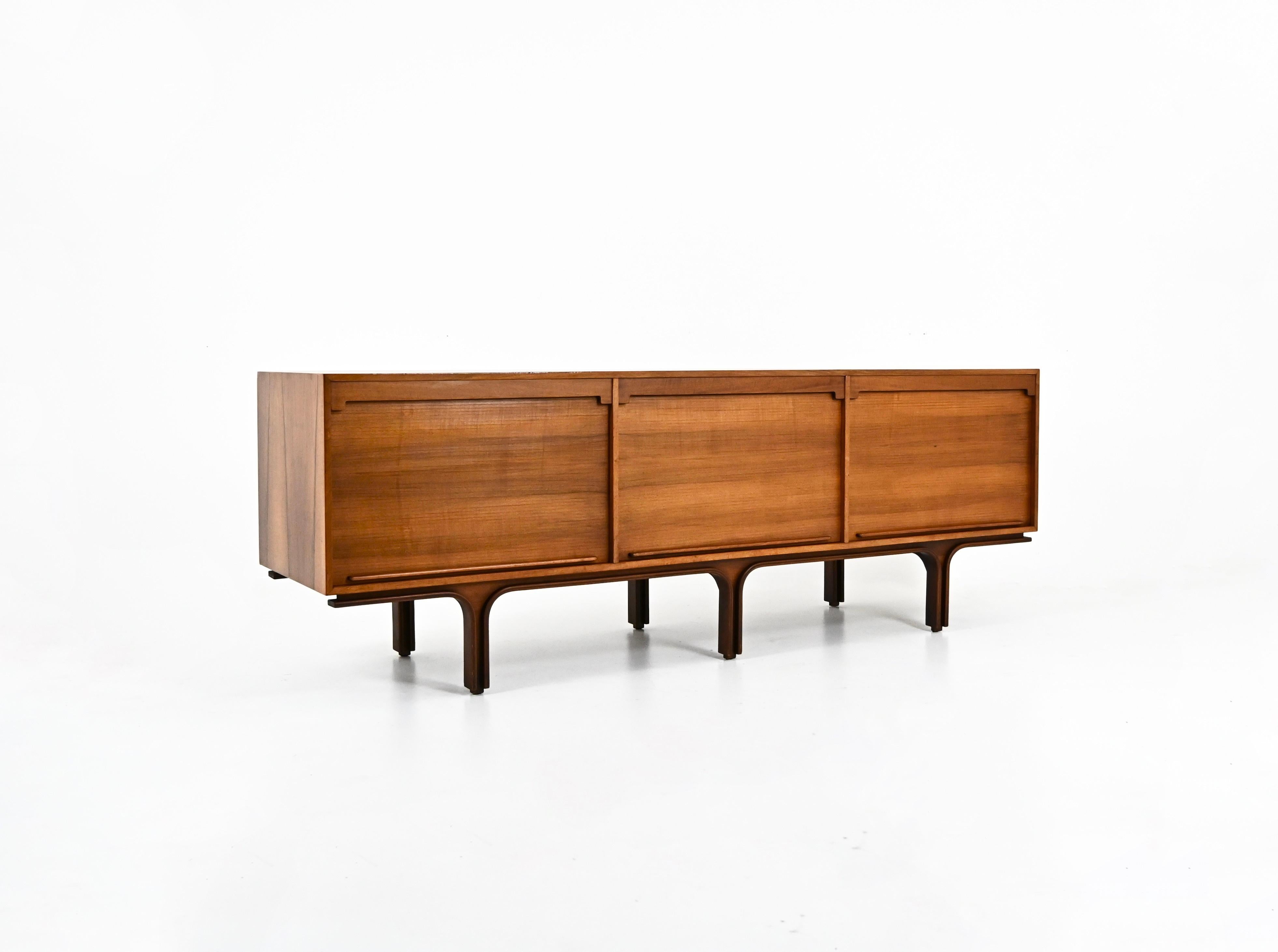 Wooden sideboard with 3 roll-top doors containing a shelf and 4 drawers. Stamped Bernini on the inside. Wear due to time and age
FOR SHIPPING, REQUEST US FOR RECEIVE THE BEST PRICE
