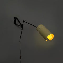 Italian mid-century modern adjustable wall lamp in metal and brass, 1950s