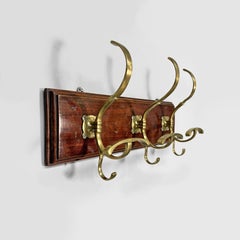 Italian Art Nouveau wall coat rack in wood and brass, 1920s