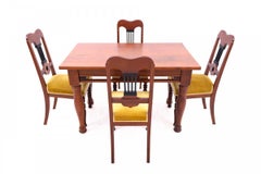 Antique A table and four chairs from the early 20th century.