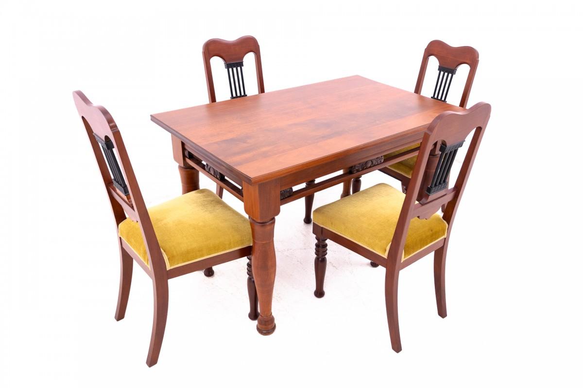 A set of four chairs with a table from the early 20th century.

The furniture is in very good condition, after professional renovation.

Dimensions:

Table: height 79 cm width 125 cm depth 77 cm

Chairs: height 100 cm / seat height 45 cm / width 45
