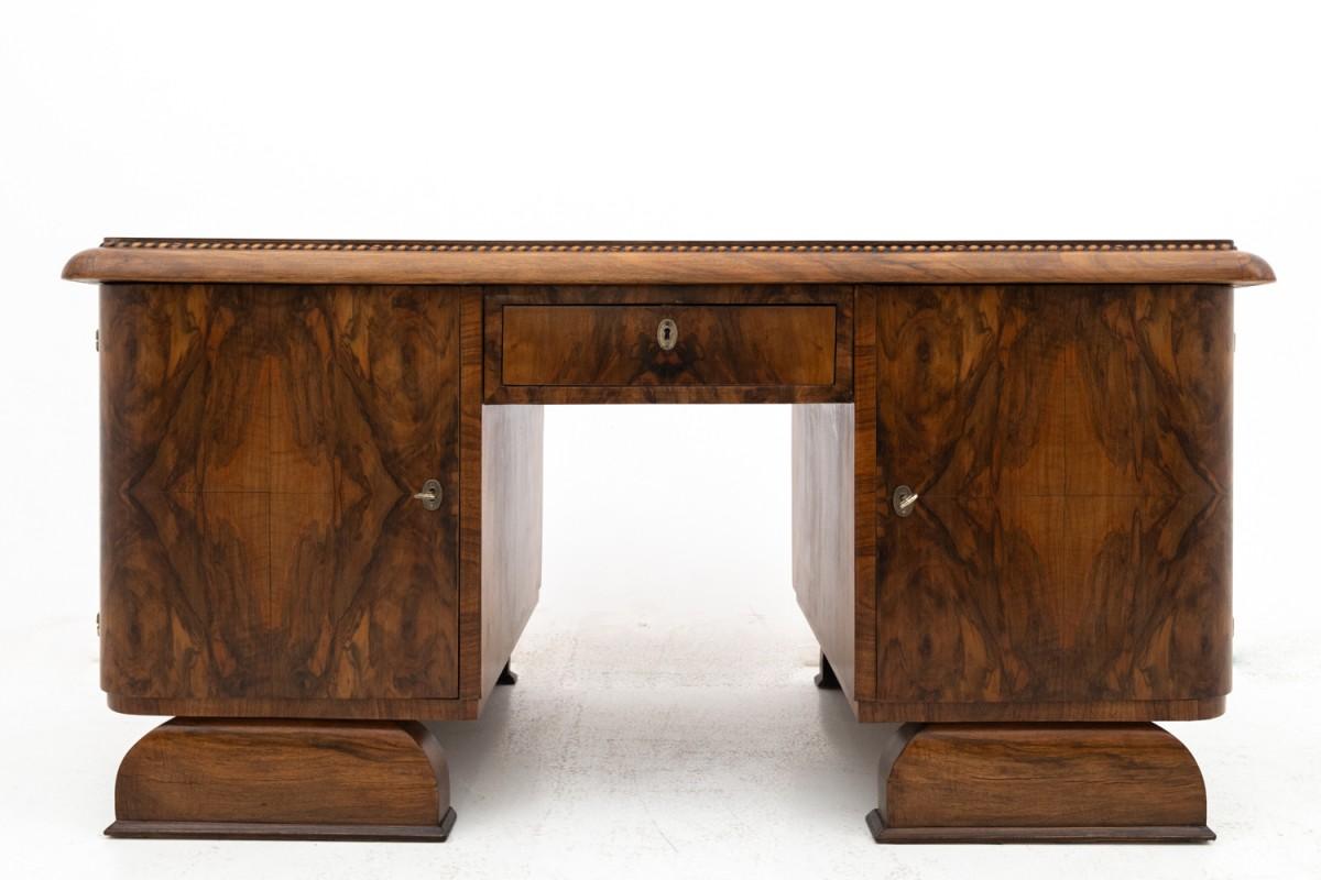 Impressive Art Deco desk, Poland, ca. 1930.

Single-sided desk with a geometric form characteristic of the Art Deco style. Functional desk with a large worktop has four practical drawers. Shallower, half-open drawers on the left side are ideal for