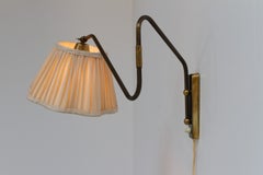 Dänische Designer-Wandleuchte aus Messing mit schwenkbarem Arm von Teknika, Dänemark, 1950er Jahre.