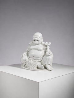 Antique ceramic Buddha statue, seated and smiling, attributed to masters from Fujian.