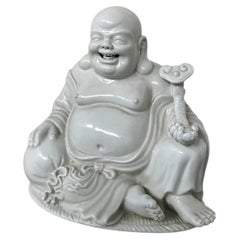 Antique ceramic Buddha statue, seated and smiling, attributed to masters from Fujian.