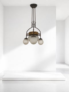 Italian Art Nouveau chandelier made of iron and brass, with original period glass
