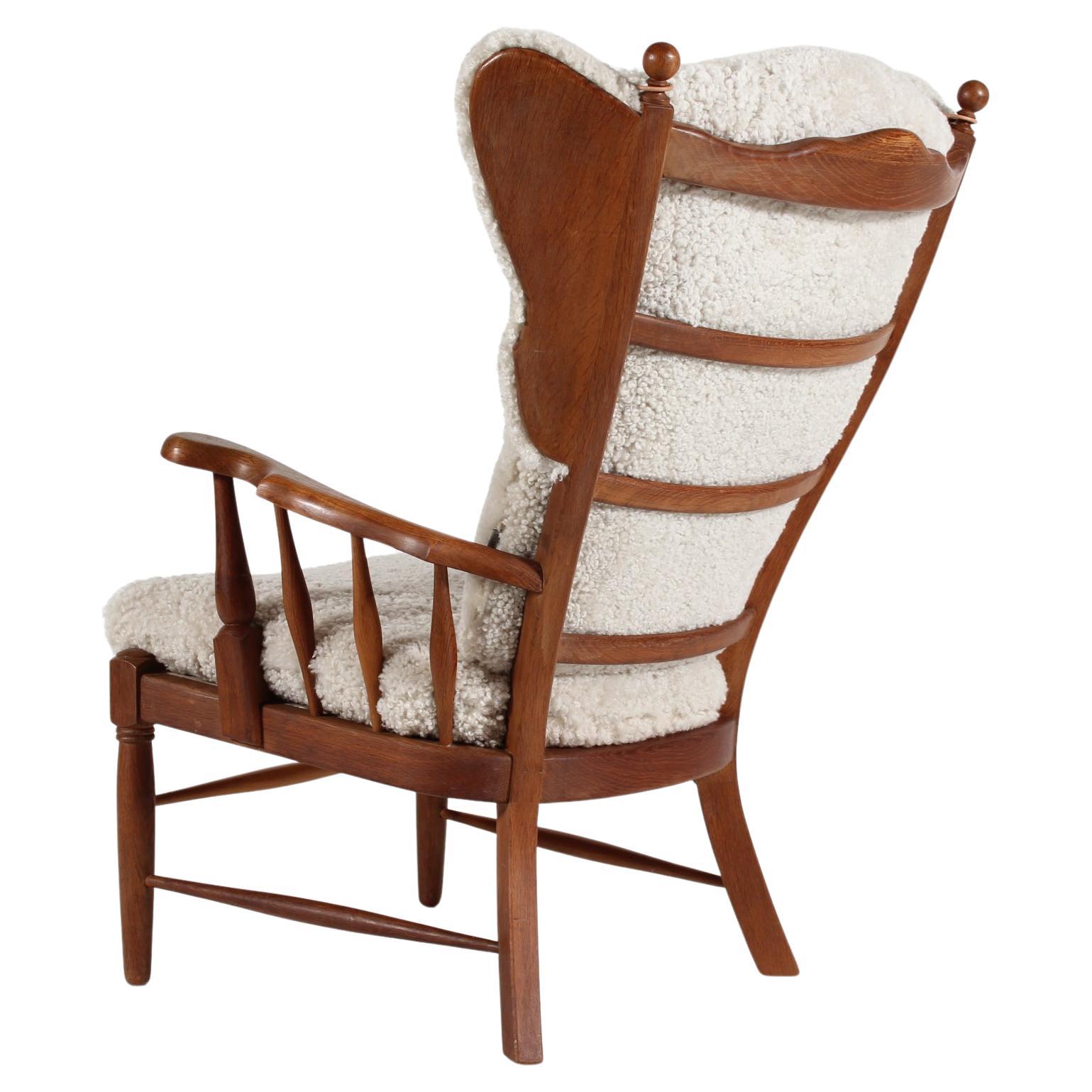 Stunning Henning Kjærnulf Style High Back Armchair of Solid Oak Denmark 1970s