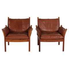 Paire de fauteuils « Genius » d'Illum Wikkelsø en bois de palissandre et cuir marron, années 1970