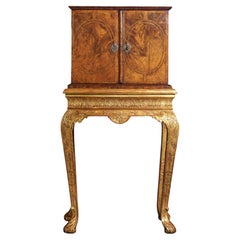 A Fine William and Mary Figured Walnut Cabinet on a Gilt-Gesso Stand, Circa 1700