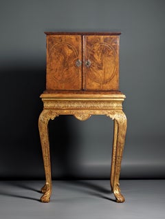 A Fine William and Mary Figured Walnut Cabinet on a Gilt-Gesso Stand, Circa 1700