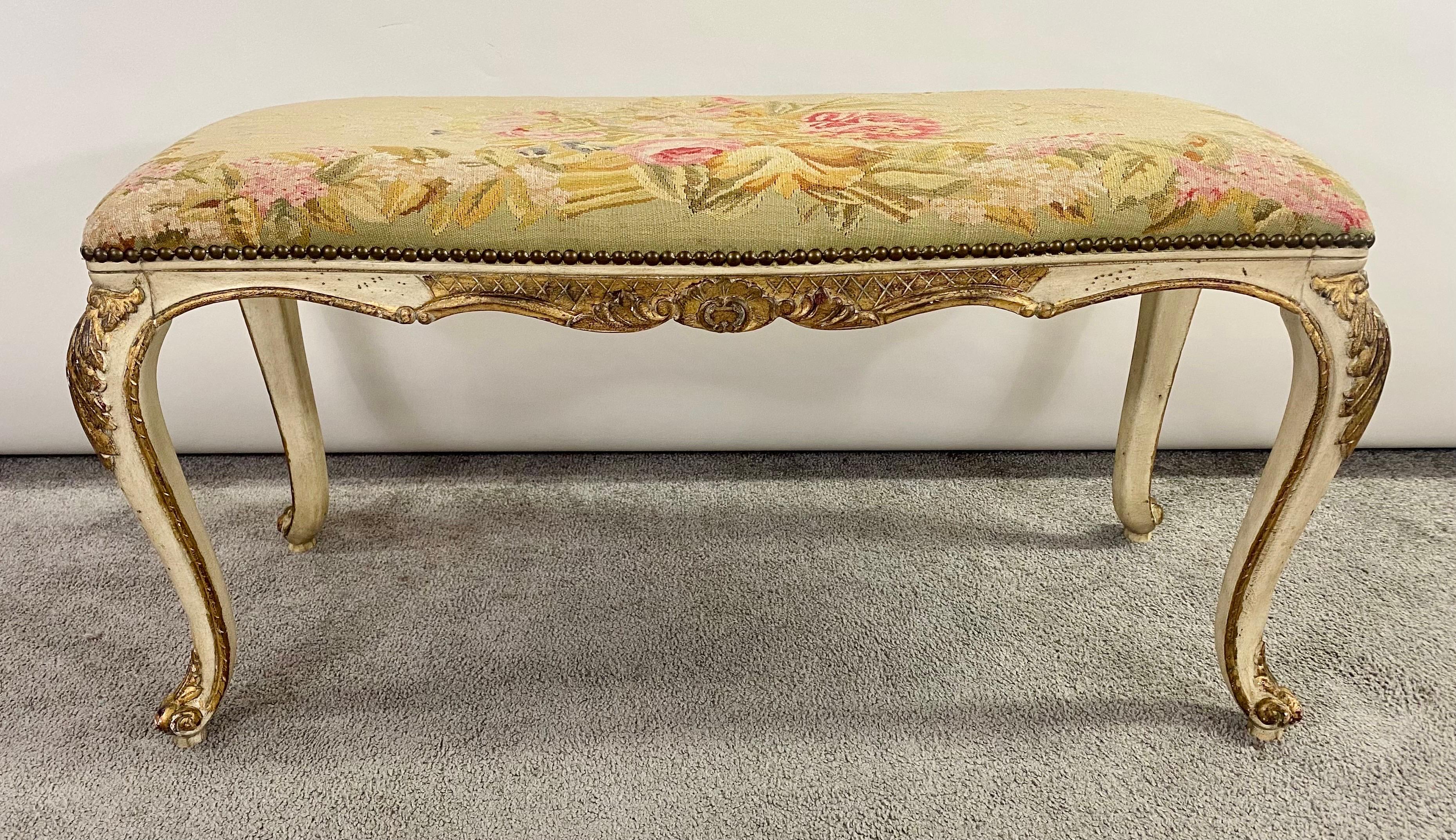 Louis XV style needlepoint bench. The wood frame is nicely hand carved and gilt decorated. The needlepoint cushion features floral design. Timeless and stylish the bench will add elegance to any space of room design. 

DIMENSIONS : 8 x 36 x 16 in.