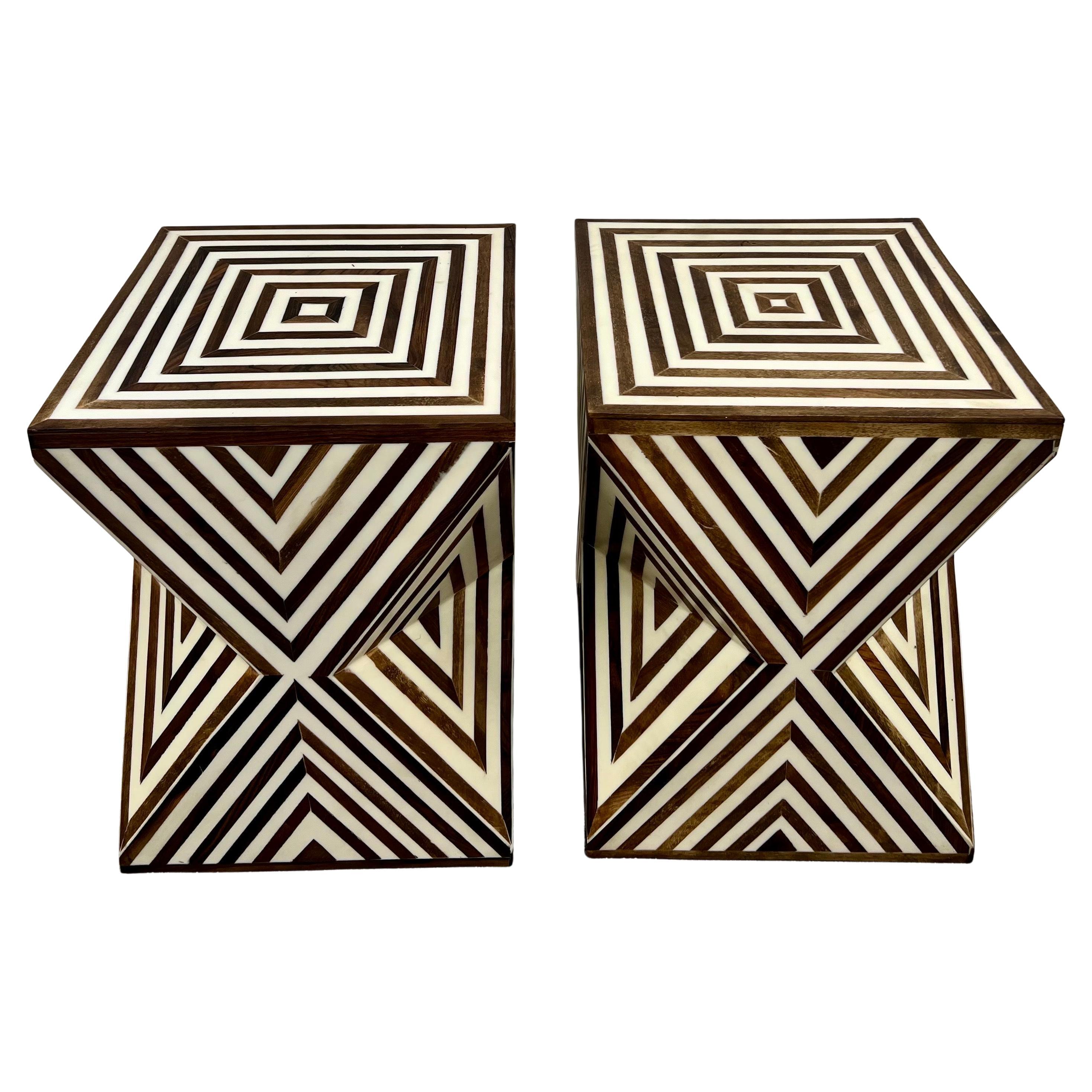 An elegant pair of sculptural side tables encapsulates the bold geometric precision of Art Deco design, seamlessly blended with a contemporary aesthetic. Crafted from high-quality resin and walnut, these tables feature a striking brown and white