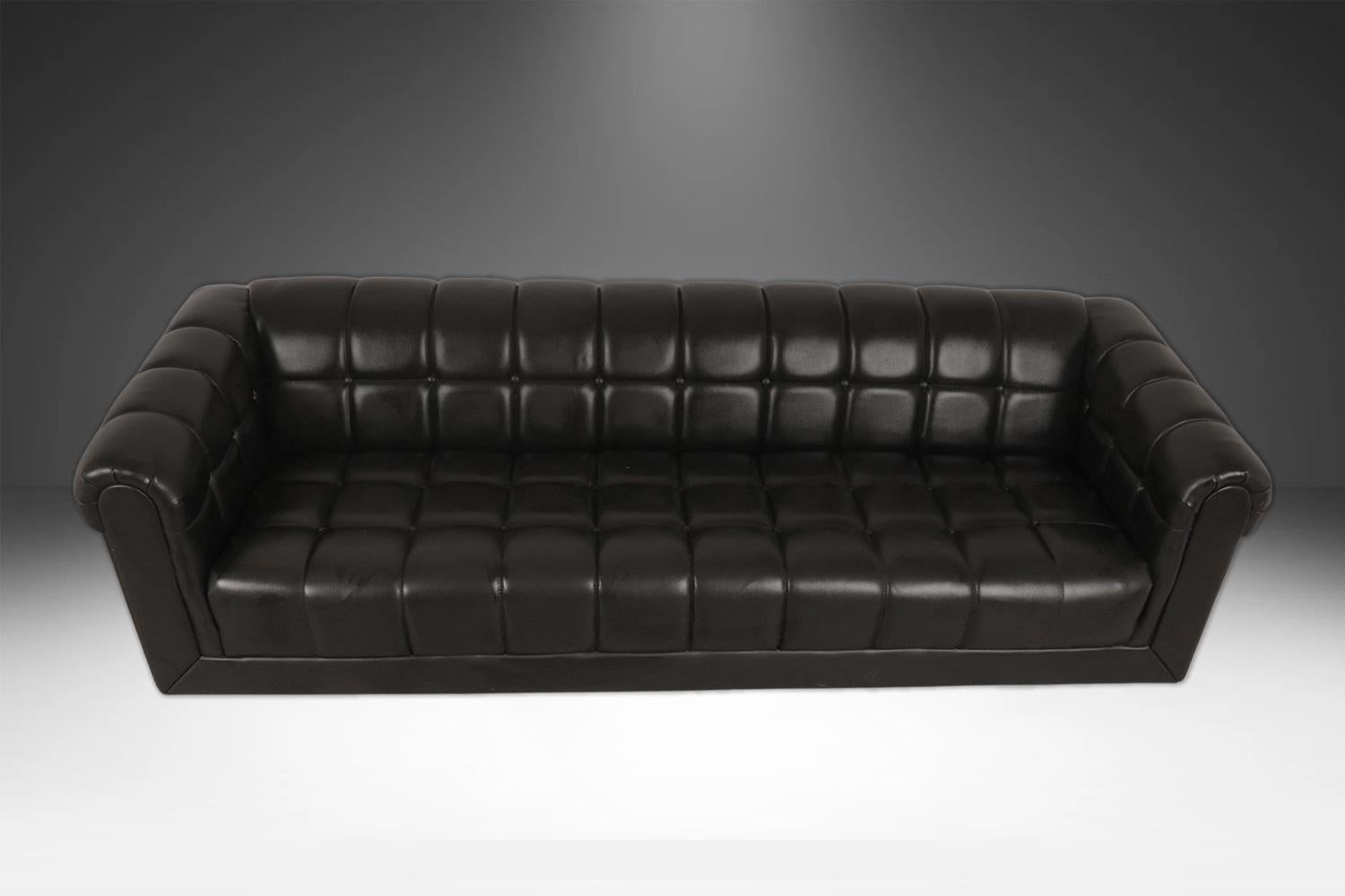 This is a very handsome, gorgeous black leather geometric tufted pattern sofa by the Kroehler Mfg. Company, in the style of Edward Wormley for Dunbar. The design of the frame is remarkably attractive in beautiful original leather with modern