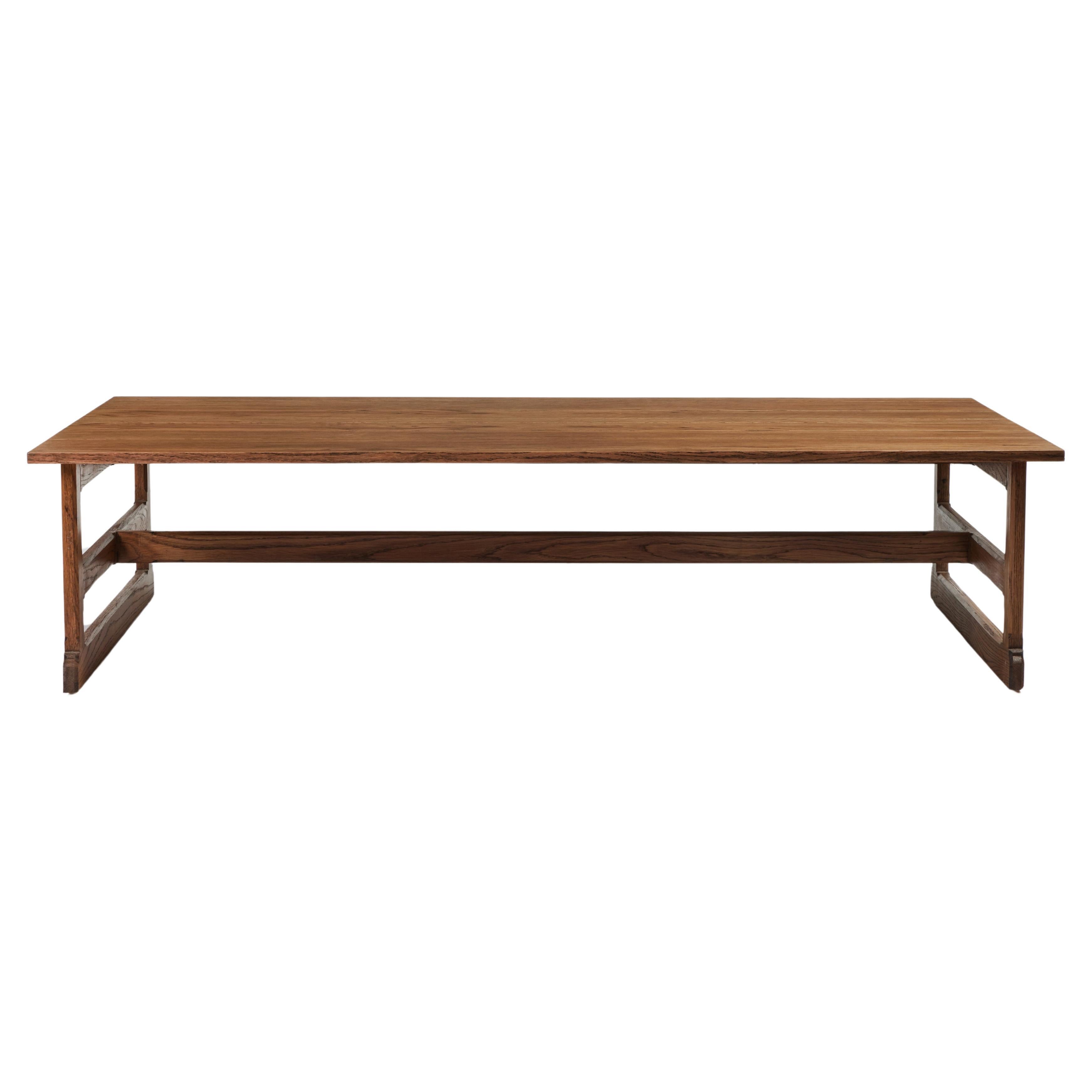 Martin & Brockett's West Large Trestle Console features a modern craftsman style and a rustic sinewy frame with hand carved details and a planked top. Shown here in our Tanned finish on Oak. 

Part of our West Trestle Collection. Other finishes and