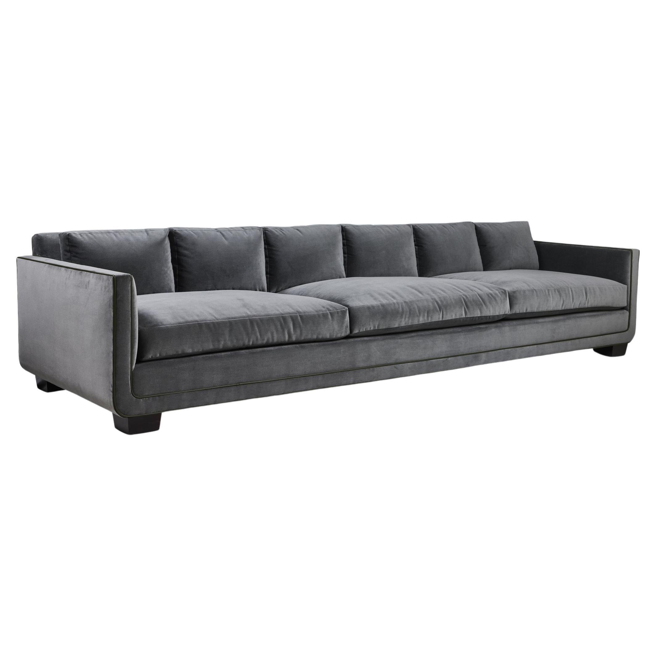 Modern Streamlined Sofa with Curved Base Detail by Martin & Brockett, 10ft Long For Sale