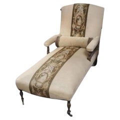 Antique Victorian Eastlake Chaise Lounge With a Tapestry Stripe.