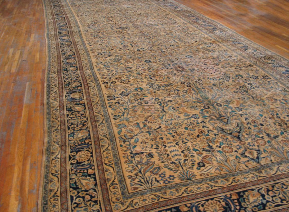 A Mashad rug uses cotton to form a base followed by a wool pile for a soft, cozy and durable texture. The Mashad rug typically has medallions and pendants woven throughout with ivory, red and blue as its commonly used colors.

This antique Mashad is