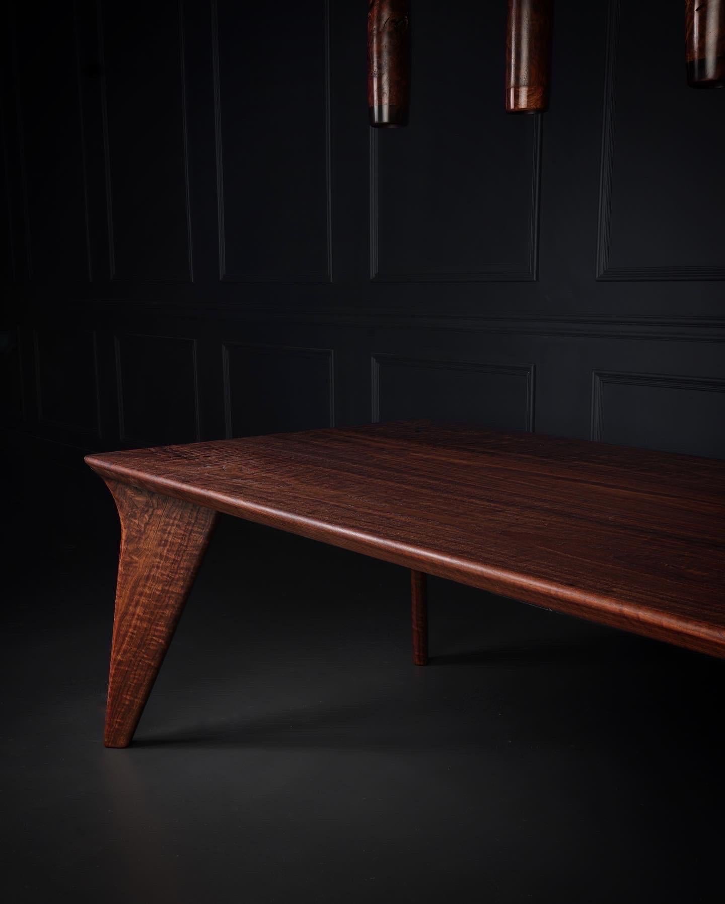 The Vöeg table in solid wood features just that....solid wood, no screws, metal or other. This particular table was handcrafted from matching boards in some of the curliest American Black Walnut we have ever had the pleasure of working with. 

The