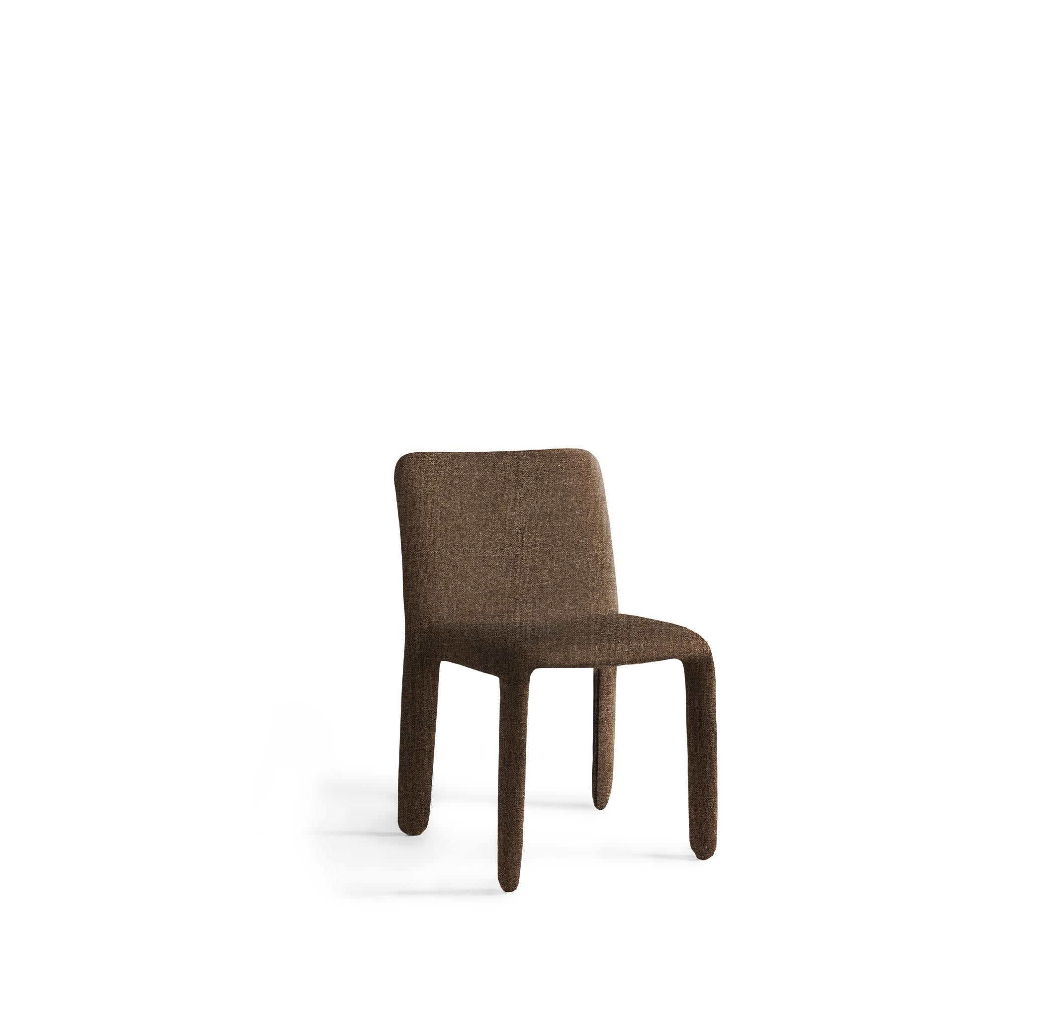 A dining chair without armrest that carries the essence of contemporary. Master craftsmanship values are expressed by the processing of the highest quality raw materials. The details are made with care and passion ending up with a perfect seating