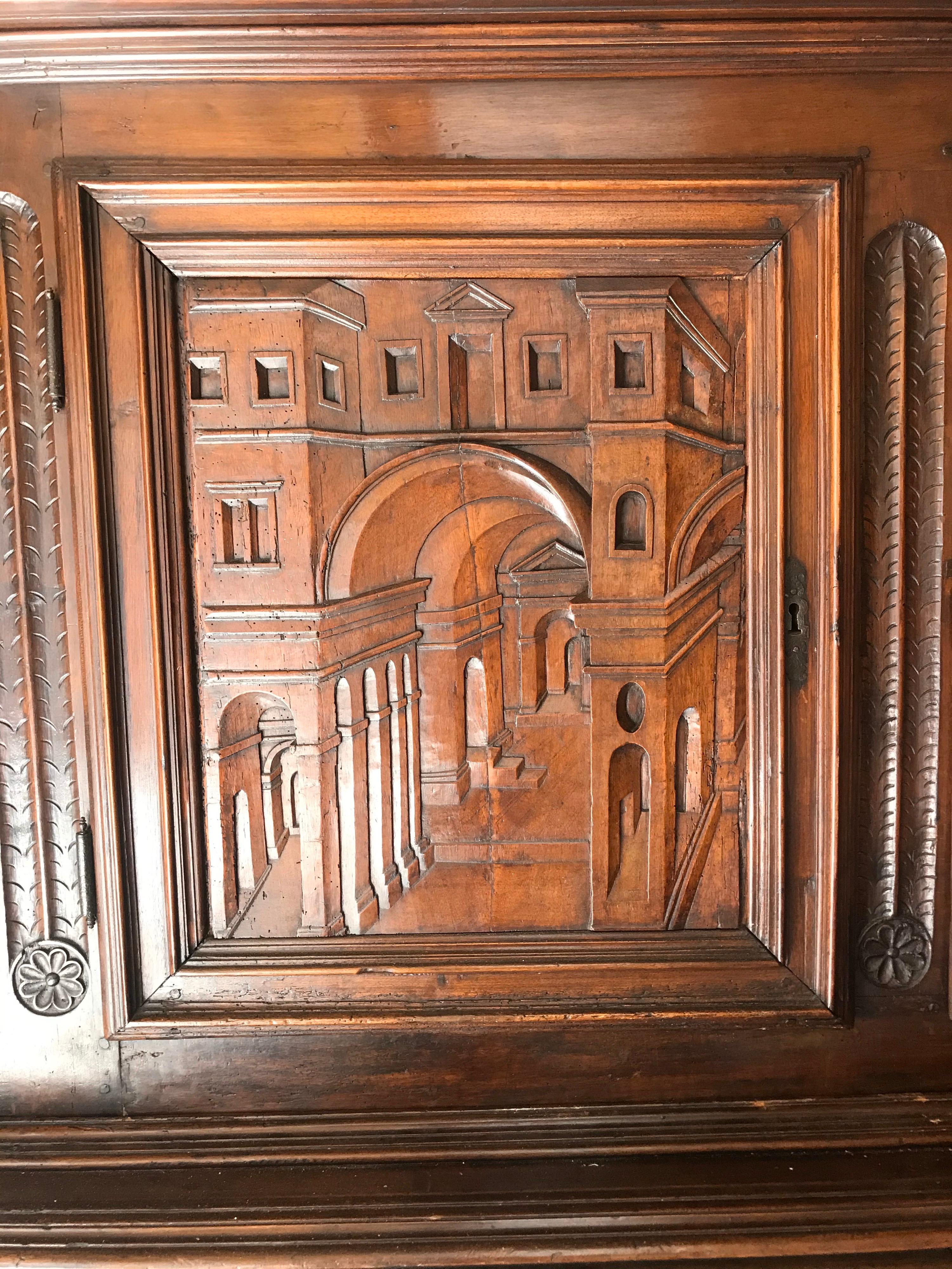 18th Century and Earlier 18th Century Italian Carved Walnut Cupboard with Italian Scenes Carved in Doors
