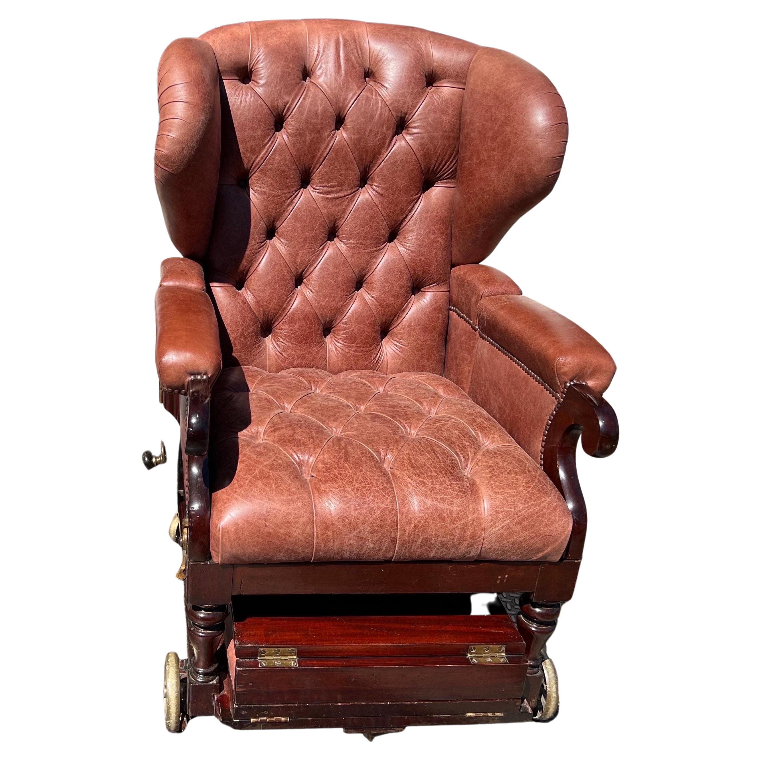Fantastic piece of labeled 19th century London made metamorphic furniture in recently tufted leather by J. Ward, “manufacturer to the Queen and royal family”.

The chair reclines (from 34” to 62” with ottoman slid in place) with leather wrapped