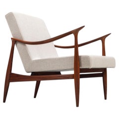 Sculptural Danish lounge chair in teak and fabric Denmark 1960