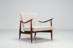 Sculptural Danish lounge chair in teak and fabric Denmark 1960