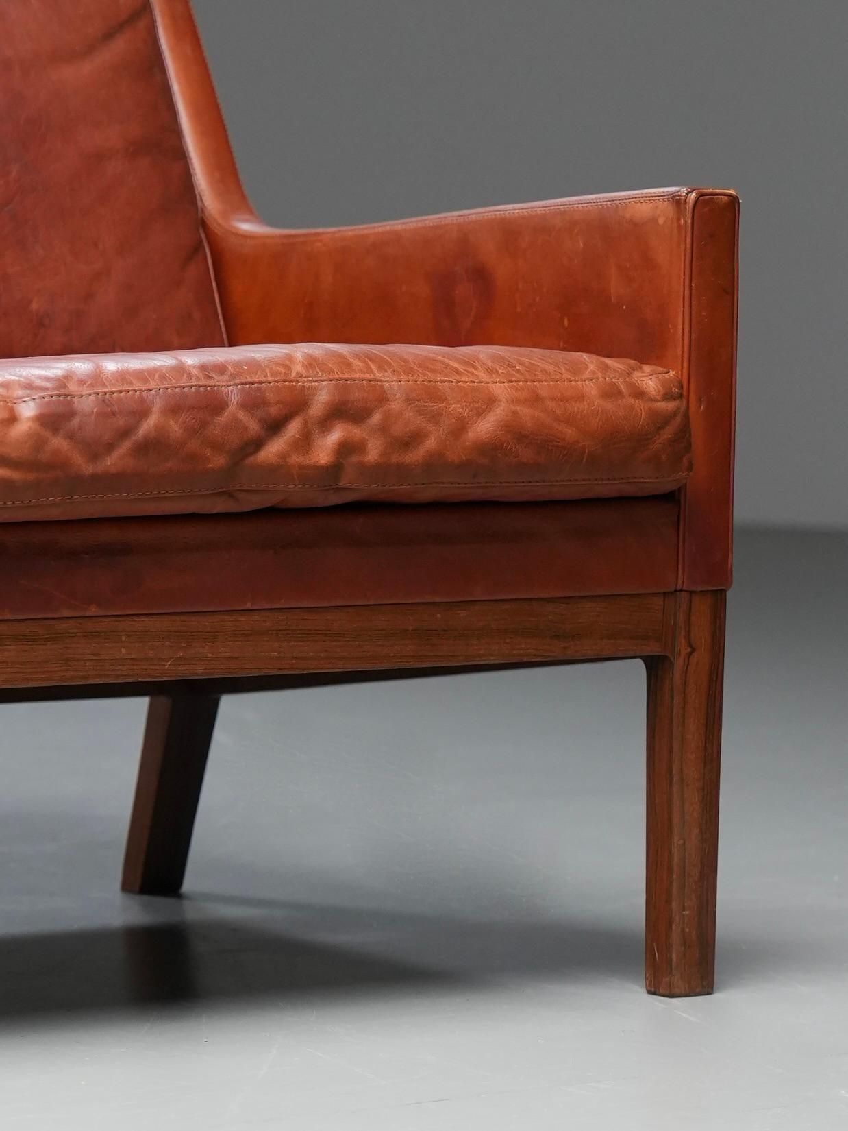 Danish Kai Lyngfeldt Larsen 2 seat sofa in cognac patinated leather, Denmark, 1960’s For Sale