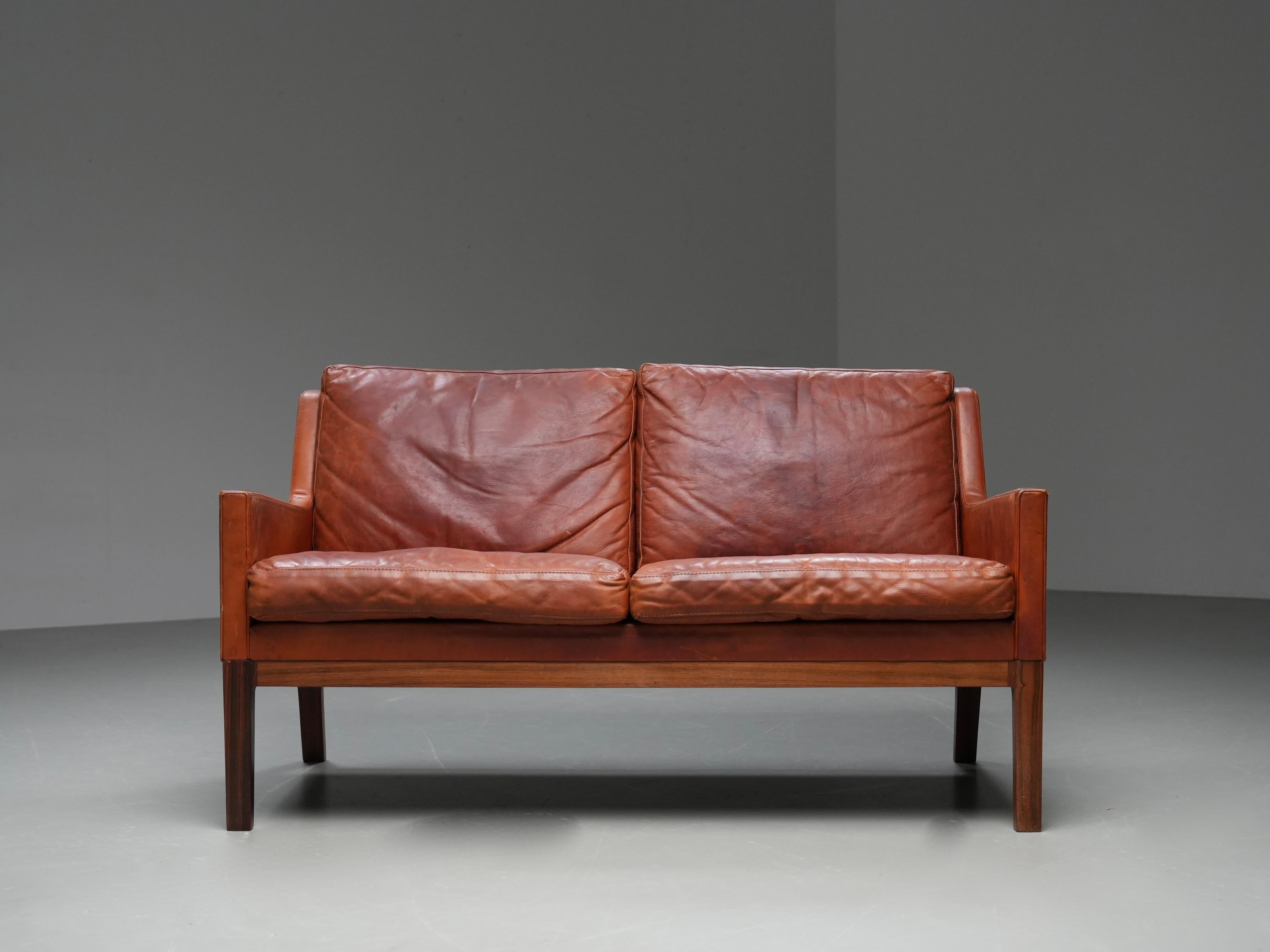 Scandinavian Modern Kai Lyngfeldt Larsen 2 seat sofa in cognac patinated leather, Denmark, 1960’s For Sale