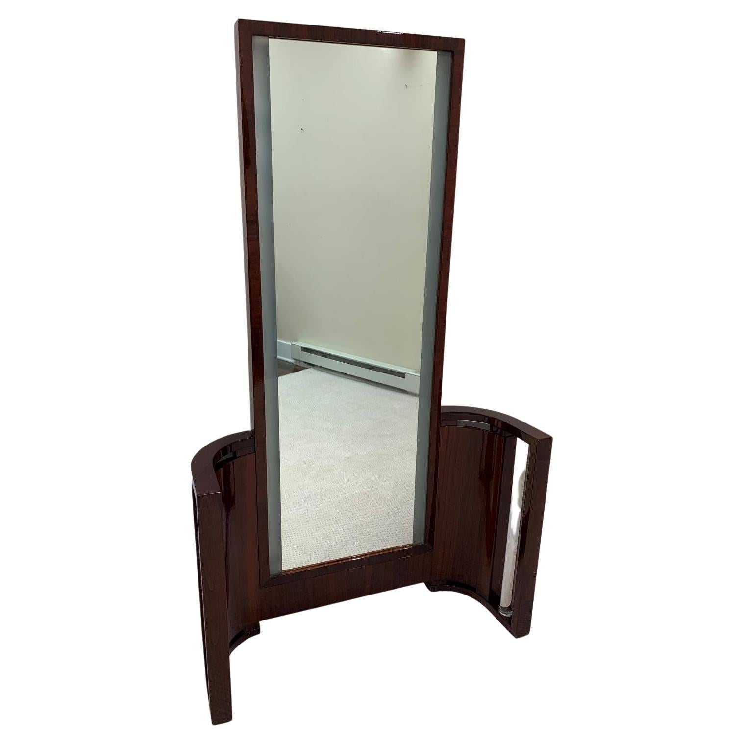 Professionally restored, very unique and rare Art Deco vanity with a light-up mirror all in walnut. Great design with two solid glass rods. This vanity would be great with a bench or could be utilized in almost any room as a full-length mirror. The