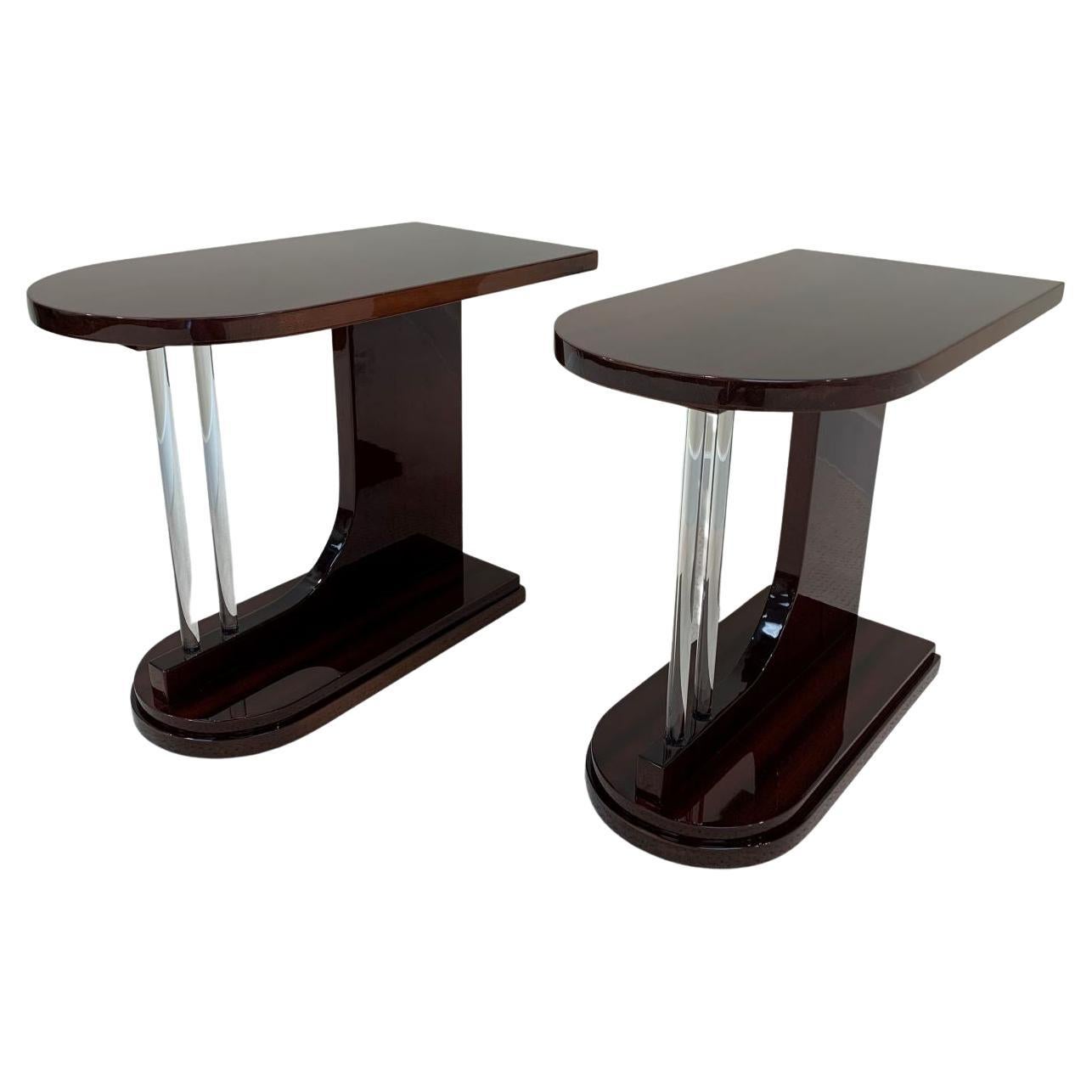 Pair of Machine Age Art Deco Side Tables. Also willing to sell as a single table. The tables have a unique bullet shape design with two solid glass decorative elements. The mahogany is beautifully restored in a gloss finish. Solid glass rod is three