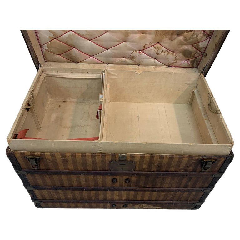 This magnificent striped steamer trunk from the Louis Vuitton brand mixes  solid brass and leather