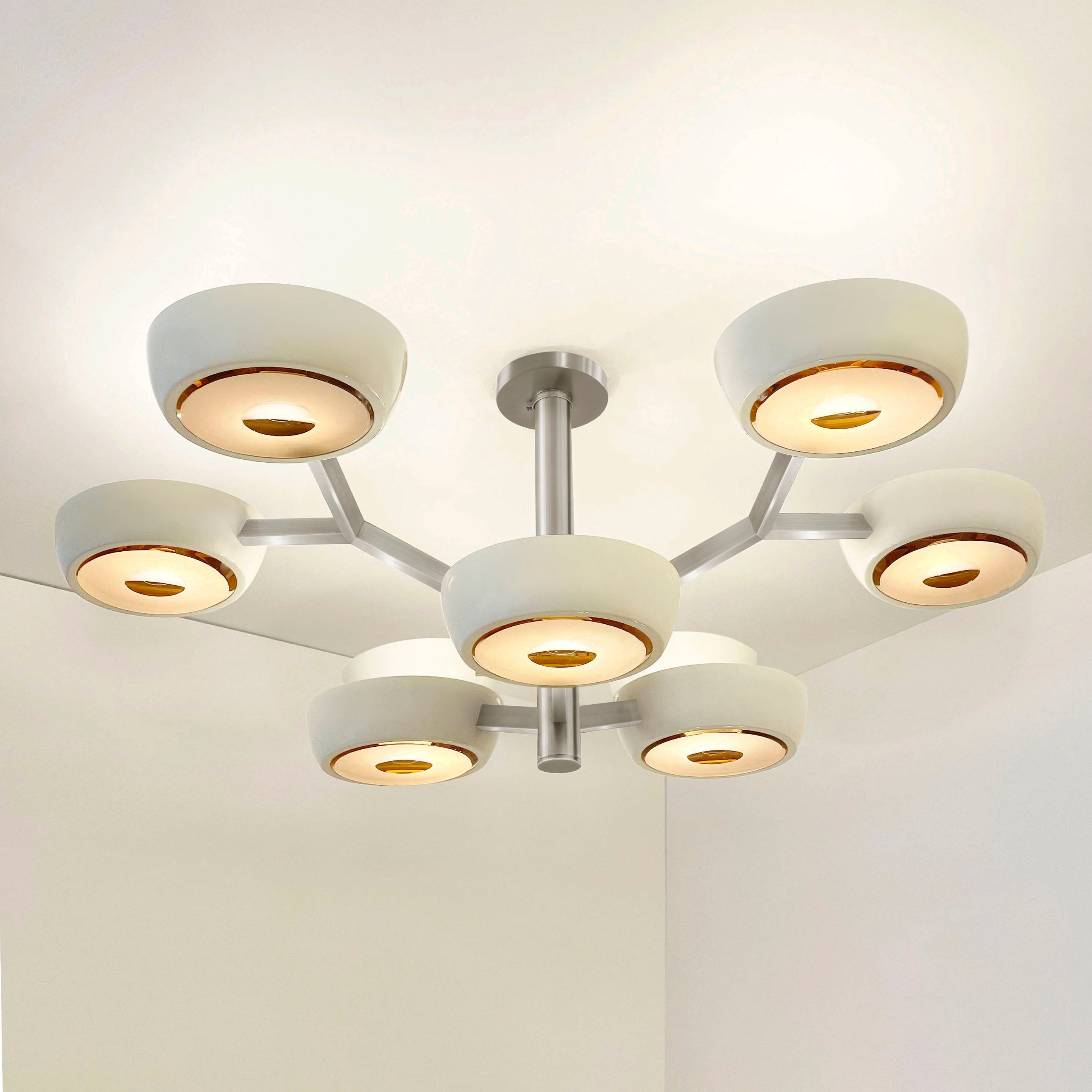 The Rose ceiling light is distinguished by its branching two-tiered frame ending with clean and modern shades. With the option to customize the color of the shades, the finish of the metal and the type of glass, the Rose is one of our most adaptable