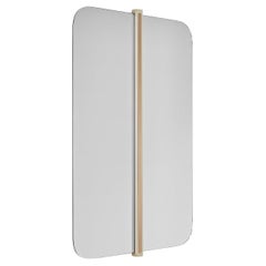 GABRIEL mirror with brass color detail on center and rounded ends